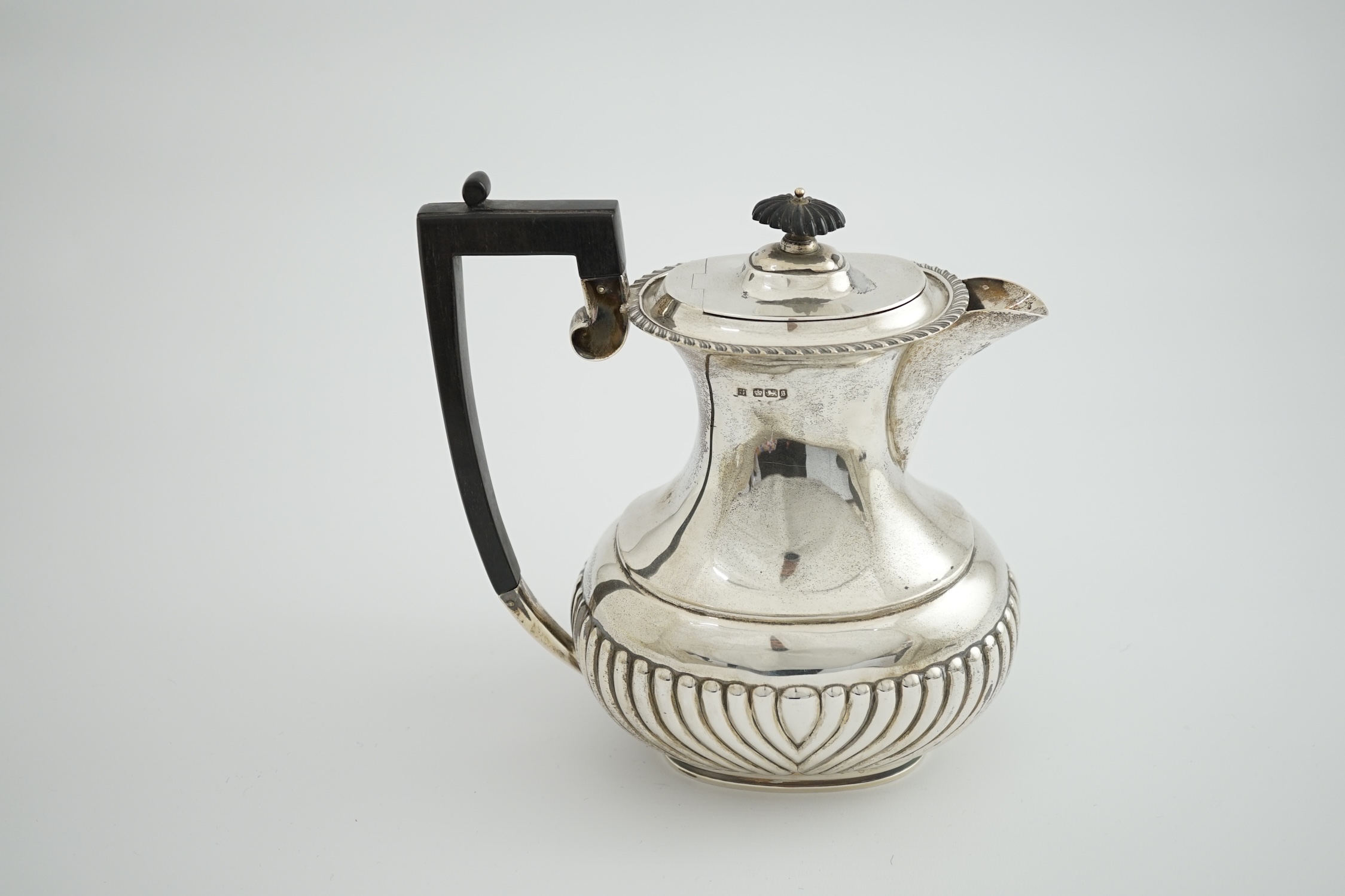 A late Victorian demi fluted silver oval coffee pot, by Fordham & Faulkner